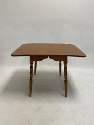 Light Oak Wood Drop-leaf Dining Table In A Classic Farmhouse Or Colonial American Style
