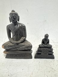 Pair Of Hand-carved, Dark Wood Or Stone Buddha Statues Depicting The Buddha In A Seated, Meditative Posture.