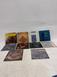 Various Classical Music Vinyl Records Featuring Works By Composers Such As Paganini, Bach, Brahms, And Chopin,