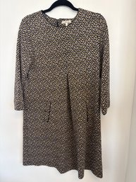 Knit Dress In A Geometric Print With 3/4 Sleeves And Tan, Black And Peach Colors