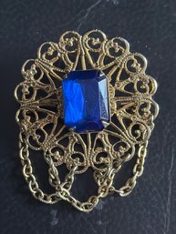 Vintage Czech Filigree Brooch Featuring A Large Rectangular Sapphire Blue Glass Stone