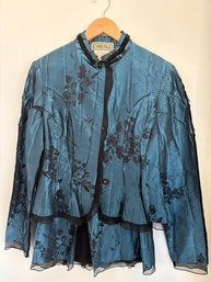 Carlisle Jacket Features A Blue And Black Floral Design With A Peplum Hem And Black Velvet Trim