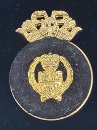 Vintage Heraldic Creast Pin Featuring A Crowned Sheild Adorned With Emblems Like A Maltese Style Cross
