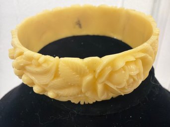 Vintage Yellow Celluloid Bangle Bracelet Featuring A Deeply Carved Floral Design