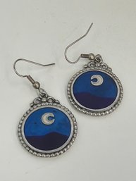 Silver Colored Dangle Earrings Featuring A Night Sky Scene With A Crescent Moon