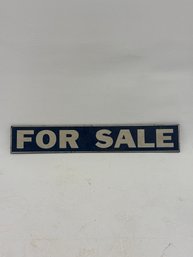 Decorative Vertical Sign Featuring The Text 'FOR SALE' In Bold White Lettering Against A Dark Blue Background.