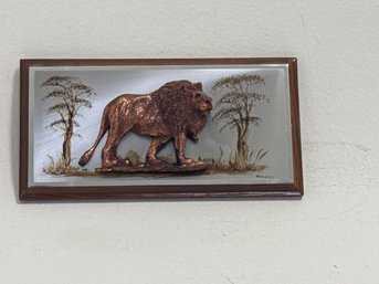 Vintage Lion Figure Mounted On A Mirrored Or Copper Background With A Wooden Frame.