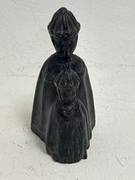 A Vintage  Figure Depicting A Mother And Child, Possibly Amish Or Dutch In Style