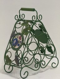 Decorative Green Wrought-iron Wine Rack Featuring A Vine-leaf And Grape Motif.