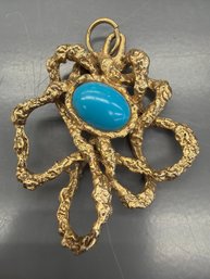Vintage Textured Gold Brooch Or Pendant Featuring A Central Turquoise Stone