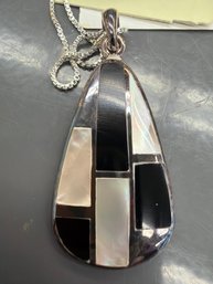 Sterling Silver Pendant Necklace Features A Teardrop Shaped Inlay Of Natural Black Onyx And Mother Of Pearl