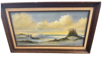 Framed Landscape Painting Depicting A Beach Scene With Sand Dunes, Seagrass And Ocean Waves