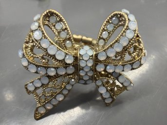Large Ornate Gold-tone Bow Ring With Opalescent Stones
