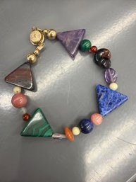 Mukti-stone Statement Bracelet Featuring Various Gemstone Beads Including Lapis Lazuli And Malachite