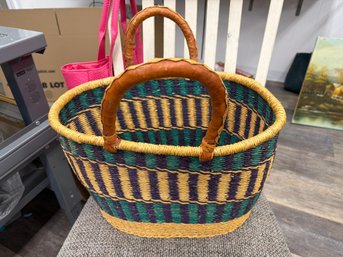 Handwoven Bolga Market Basket From Ghana Featuring A Vibrant Blue And Green Geometric Patterns And Leather