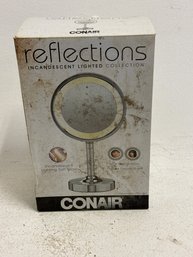 Is A Conair Reflections Incandescent Lighted Collection Double-sided Makeup Mirror.