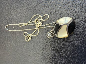 Vintage Modernist Sterling Silver Pendant Necklace Featuring An Inlaid Mosaic Of Black Onyx And Mother Of Pear