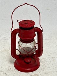 Vintage Small Red Kerosene Lantern, Specifically A Globe Brand No. 202 Model.