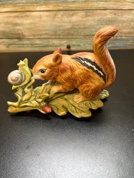Vintage Porcelain Figurine Featuring A Chipmunk And A Snail On A Leaf, Produced By Price Products. It Serves
