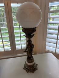 Antique Victorian-era Figural Cherub Banquet Or Parlor Lamp, Often Featuring A Brass Or Spelter Finish, A Marb