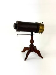 Antique Kaleidoscope On Wooden Stand