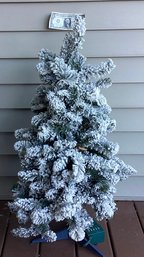 Table Size Pre-lit Flocked Christmas Tree With Controls.