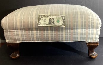 Vintage Footstool In A Light Toned Material And Wood Feet