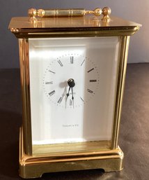 Vintage Tiffany & Co. Brass Carriage Clock  With White Dial, Roman Numerals, & Quartz Movement.