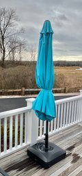Frontgate Outdoor Umberella With Moveable Base.