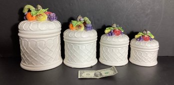 4 Ceramic Italian Kitchen Canisters With A Fruit Design Atop Of Each Lid