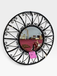 Round Black Wrought Iron Scrollwork Mirror, 23' × 23'.