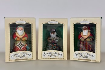 Grouping Of Hallmark Santa Ornaments