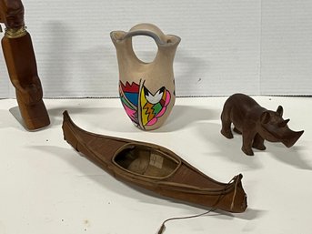 Asst Lot Incl  Handmade Canoe  Decorated Indian/ Mexican 2 Handle Vase Carved Rhino And Tribal Figure