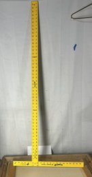 A Yellow Empire Drywall T-square And A Ruler