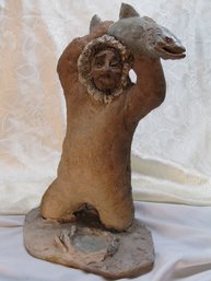 UNSIGNED  CLAY SCULPTURE ESKIMO WITH FISH