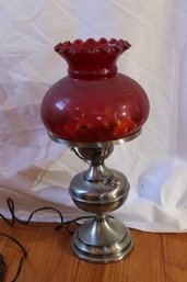 Metal Lamp With A Ruby Red Lamp Shade