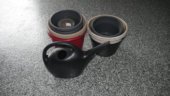 Watering Can And Plastic Planters