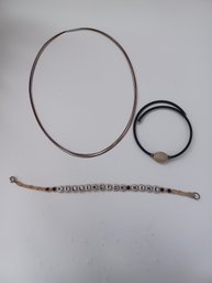 A Choker And Two Bracelets
