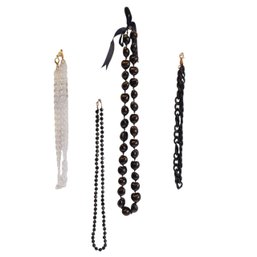 4 Necklaces: 3 Plastic Costume, 1 Hawaiian Black Kukui Nut Lei