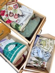 Three Drawers Full Of Oven Mitts, Hand Towels, Aprons Etc (K)