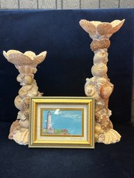 2 Seashell Pillars And A Framed Picture Of A Lighthouse