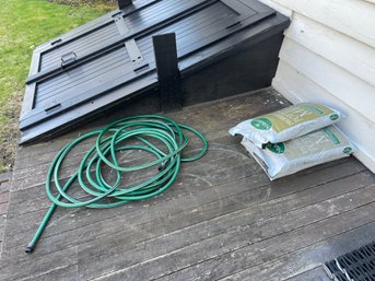 Hose & 3 Bags Of Mahoneys Potting Soil