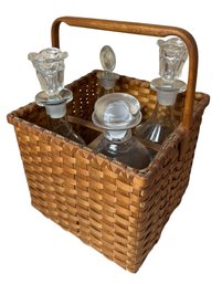 Woven Basket Full Of Four Glass Decanter Bottles (DR)
