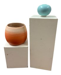 Modern Art Pottery Vessels On White Wooden Blocks