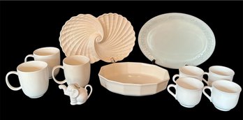 Collection Of White Mugs And Serving Pieces
