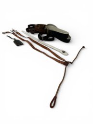 5 Belts Leather Suspenders And A Luggage Tag