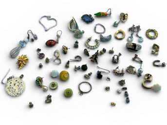 2 Pairs Of Earrings With A Lot Of Single Earrings And Earring Backs
