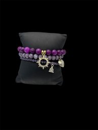3 Purple Beaded Bracelets With Charms