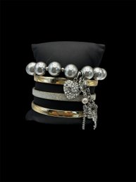 1 Juicy Couture Silver Tone Beaded Charm Bracelet And 1 Gold And Silver Tone Cuff Bracelet