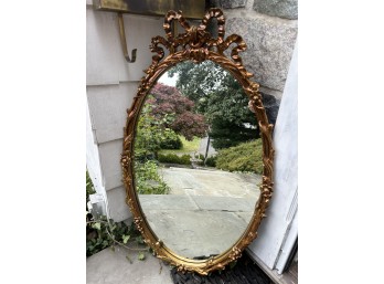 Gilded Oval Mirror With Wood Frame And Bow Design
